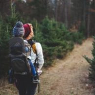 woman and child hiking in woods